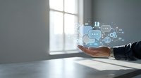 Man in business suit holding digital chatbot and AI technology icons above palm, representing artificial intelligence communication and automation solutions.
