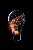 Glowing network connections form inside light bulb against black background, symbolizing innovation, artificial intelligence and digital transformation.