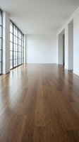 Empty modern room with hardwood floors and large windows for interior design projects and real estate presentations.
