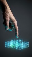 Male hand with light skin tone pointing at glowing turquoise digital wireframe cubes on dark background, representing technology, innovation, and virtual architecture for business and design projects.