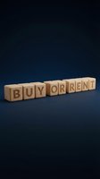 Wooden blocks spelling buy or rent on dark blue background, representing real estate decision, property investment choice, housing market concept.