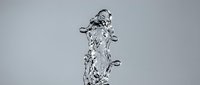 Splashing water column with droplets frozen in motion against neutral background, suitable for beverage, refreshment, and wellness marketing materials.