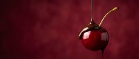 Fresh red cherry with green stem on deep burgundy background for culinary and food photography projects.