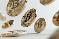 Golden bitcoin coins floating on white background, cryptocurrency concept with selective focus and shallow depth of field, modern financial technology.