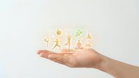 Open hand holding glowing family figures representing protection, care and support concepts for insurance, healthcare and family services.