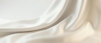 Smooth cream silk fabric with flowing waves and soft folds, creating an elegant abstract background suitable for luxury branding and design projects.