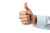 Male hand in white business shirt sleeve showing thumbs up gesture against white background, isolated positive approval sign for professional presentations.