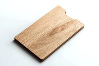 Natural oak wooden cutting board on white background, rectangular shape with minimalist design and visible wood grain texture. Isolated kitchen utensil for food prep.