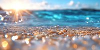 Sparkling ocean waves at sunset with golden bokeh light reflections on water surface creating magical summer atmosphere and tranquil seascape view.