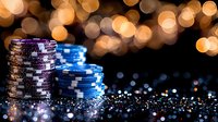 Stacks of blue and silver casino chips on dark reflective surface with golden bokeh lights creating luxurious gambling atmosphere and festive mood.