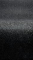 Dark gray textured studio background with curved horizon line creating depth and perspective for product photography and design presentations.
