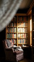 Cozy reading nook with built-in wooden bookshelf filled with books and comfortable armchair under slanted roof in warm atmospheric lighting.
