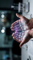 Hands holding glowing digital network connections with geometric patterns in modern technology environment for innovation concepts.