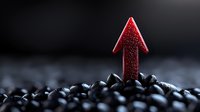 Red glowing arrow emerging from dark stones against blurred background symbolizes growth, breakthrough, and business success concept for financial presentations.