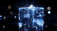 Glowing blue cube shape formed by luminous particles against dark background with bokeh effect creates magical atmosphere for technology concepts.