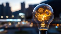 Glowing lightbulb filled with golden gears against blurred cityscape at dusk, symbolizing innovation, creativity, and business ideas for corporate and technology concepts.