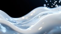 Flowing liquid waves create dynamic abstract pattern in white and blue tones against dark background, with sparkling water drops and smooth curved lines.