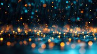 Magical night cityscape with glowing orange and blue bokeh lights reflecting on wet surface, creating dreamy atmospheric urban scene in rain.