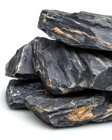 Stacked dark slate rocks with golden mineral veins isolated on white background, suitable for geology, construction, and design projects.