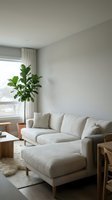 Minimalist living room with cream sectional sofa, wooden furniture, potted plant by window with natural light, neutral interior design for home decor and lifestyle content.