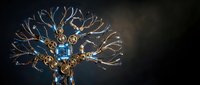 Ornate golden tree sculpture with intricate branching design and decorative elements against dark background for luxury interior decor and artistic displays.