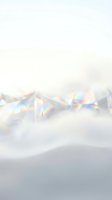 Iridescent holographic crystals scattered on soft white surface with rainbow light reflections, creating abstract luxury and modern design backdrop.