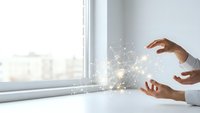 Business professional hands creating glowing network connections with digital particles and light effects in modern office workspace for technology concepts.