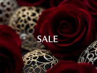 Elegant red roses with ornate golden decorative elements and sale text overlay for luxury retail marketing and promotional campaigns.