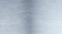 Brushed aluminum metal surface with fine horizontal lines creating sleek industrial texture for modern design backgrounds and metallic material applications.