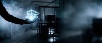 Futuristic industrial warehouse interior with glowing geometric neon logo on hand, dark moody atmosphere, modern technology concept for corporate branding and sci-fi design projects.