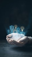 Businessman hands holding glowing digital icons of security shields, light bulbs, and gears representing innovation, protection, and technology solutions.