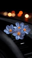 Glowing blue flowers with dewdrops on car dashboard against blurred city lights background, creating magical evening atmosphere with bokeh effects.