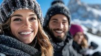 Young diverse friends enjoying winter vacation in snowy mountains, wearing warm knit hats and scarves, sharing joyful moments outdoors in cold weather.