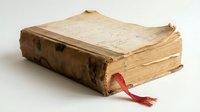 Aged leather-bound book with worn tan pages and red silk bookmark ribbon, displaying antique craftsmanship and historical literary heritage for vintage collections.