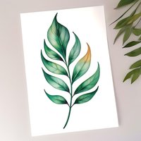 Watercolor green tropical leaf with golden accent on white background, botanical art style illustration for wall decor, cards and nature-inspired designs.
