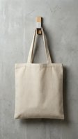 Blank natural cotton tote bag hanging on concrete wall hook for eco-friendly shopping and sustainable lifestyle branding mockup template.