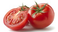 Fresh ripe red tomatoes with one cut in half showing juicy pulp and seeds on white background, isolated for food packaging and recipe design.