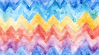 Colorful watercolor zigzag pattern with gradient rainbow effect from blue to yellow to red, creating a vibrant chevron background for creative designs.