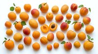 Apricots isolated on white background, whole and halved fresh fruits with green leaves, arranged flat lay for food, nutrition, and culinary design use.