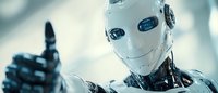 Futuristic humanoid robot with white face and metallic body giving thumbs up gesture against blurred blue background, representing artificial intelligence advancement.