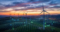 Wind turbines with digital grid overlay at sunset showcasing renewable energy technology and smart grid infrastructure for sustainable power generation.