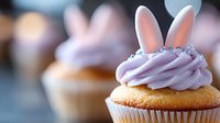 Easter bunny ears cupcake with lavender frosting and silver sprinkles on blurred background, sweet holiday treat for spring celebration and parties.