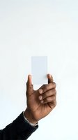 Male hand with medium-dark skin tone holding blank white card against neutral background. Isolated design element suitable for business cards, mockups, advertising campaigns, and promotional materials.
