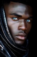 Close-up portrait of young African American male model with striking heterochromatic eyes wearing black textured scarf against dark background, dramatic lighting.