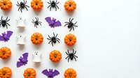 Halloween flat lay with orange pumpkins, black spiders, purple bats and white ghosts on white background for seasonal decorating and party planning.