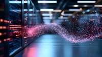 Glowing pink particle wave flowing through modern data center with server racks, representing digital transformation and data transmission in technology.