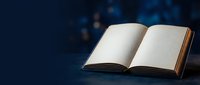 Open book with blank pages on dark blue background with bokeh lights creating atmospheric reading environment for education and literature concepts.