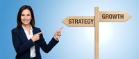 Professional businesswoman pointing at wooden directional signpost with strategy and growth arrows on blue gradient background for corporate planning.