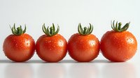 Fresh cherry tomatoes with water drops arranged in row on white background, bright red color and green stems showing natural organic produce.