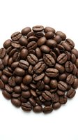 Roasted coffee beans arranged in circular pile on white background, isolated for cafe menu design and beverage marketing materials.